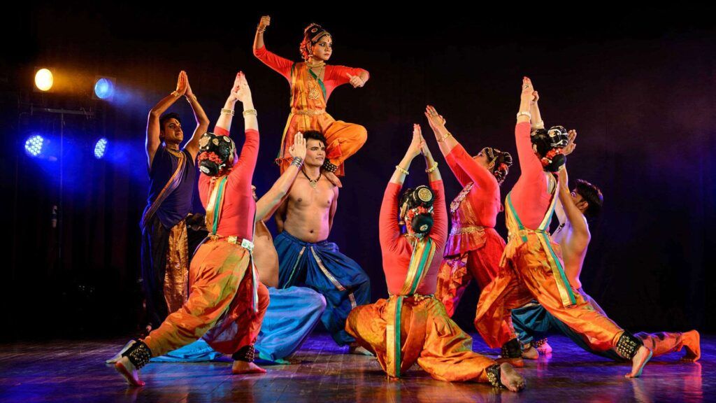 A group of people dressed in traditional clothing performing a dance. 