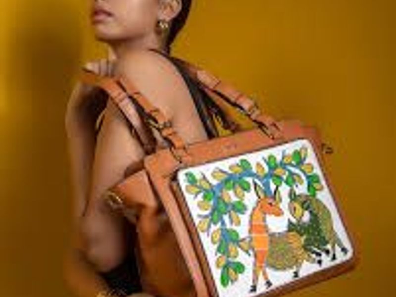 Image Source: Gond art-inspired scarves and bags designed with traditional patterns.